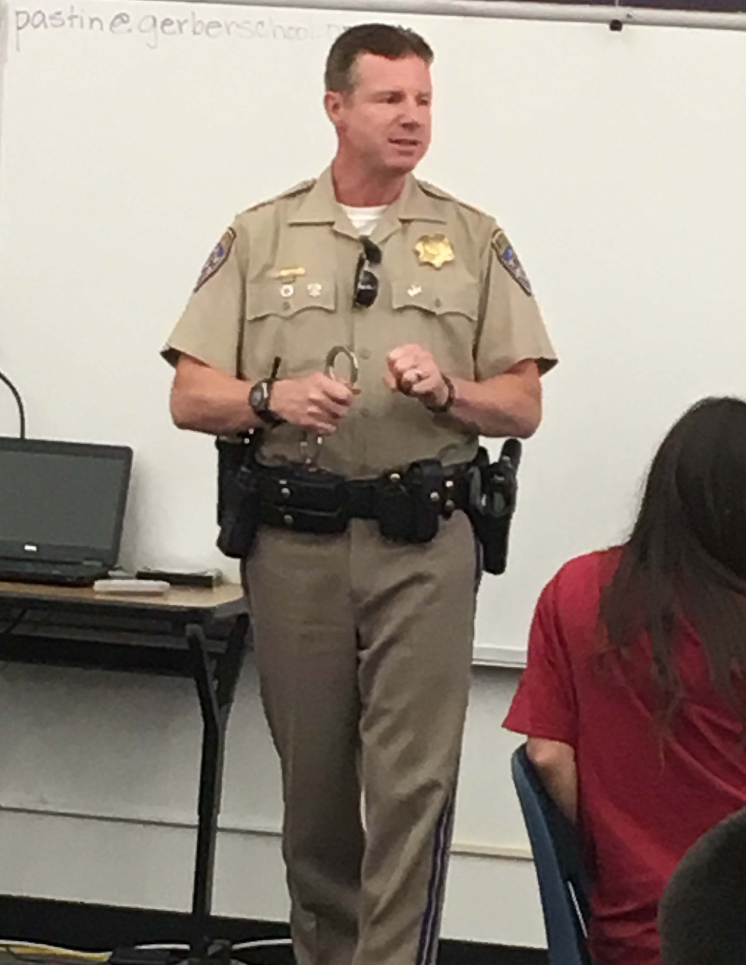 CHP officer at front of classroom